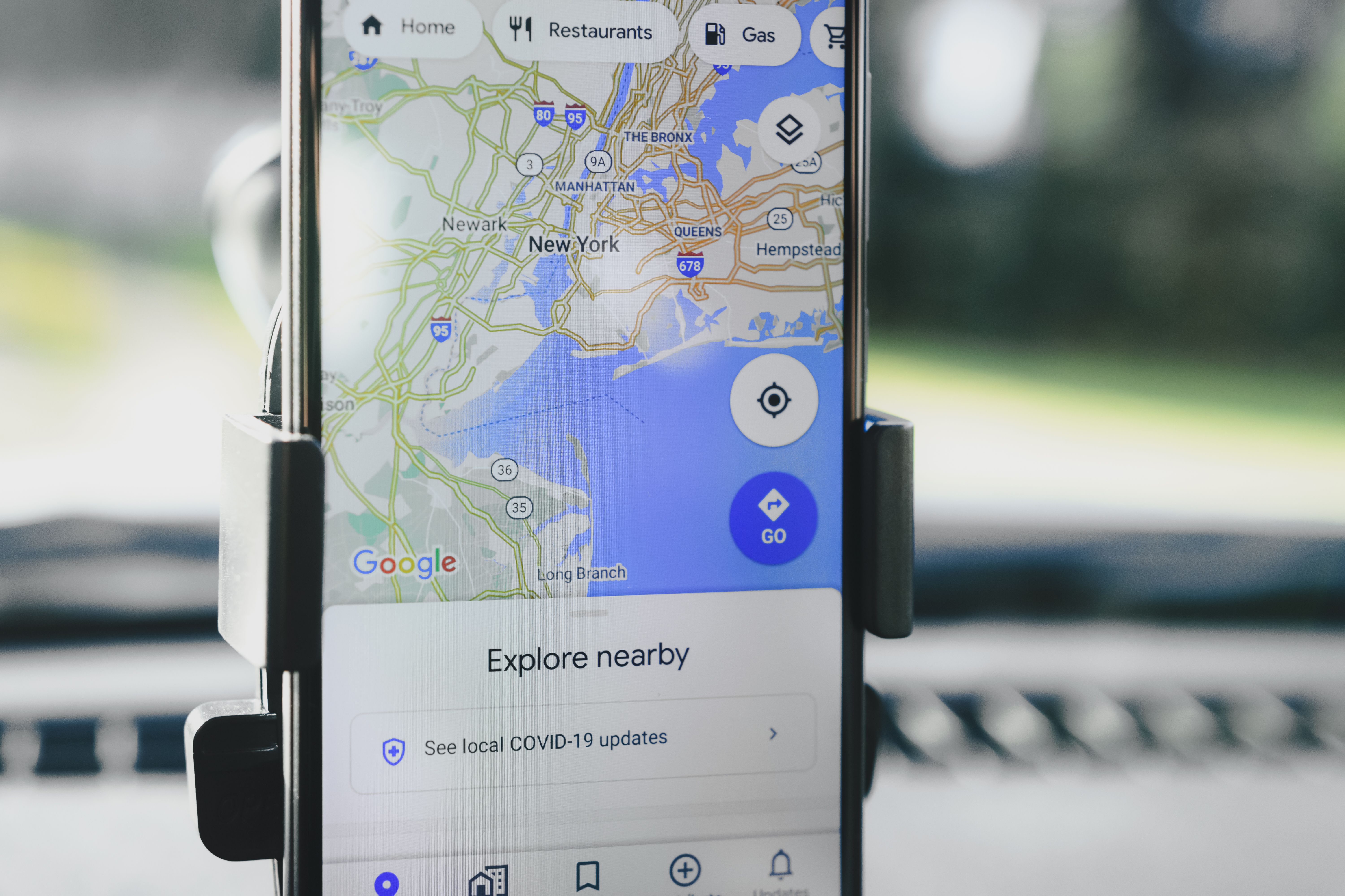 Traveler using Google Maps for navigation in a European city — offline maps work but real-time features need data